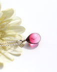 金赤薄ピンク色のグラデーションが美しい ガラスの遺骨ペンダント