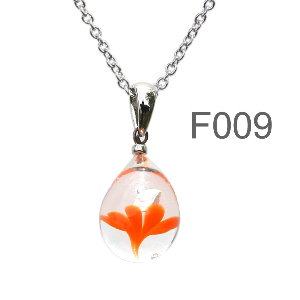不透明オレンジ色のお花が入った ガラスの遺骨ペンダント