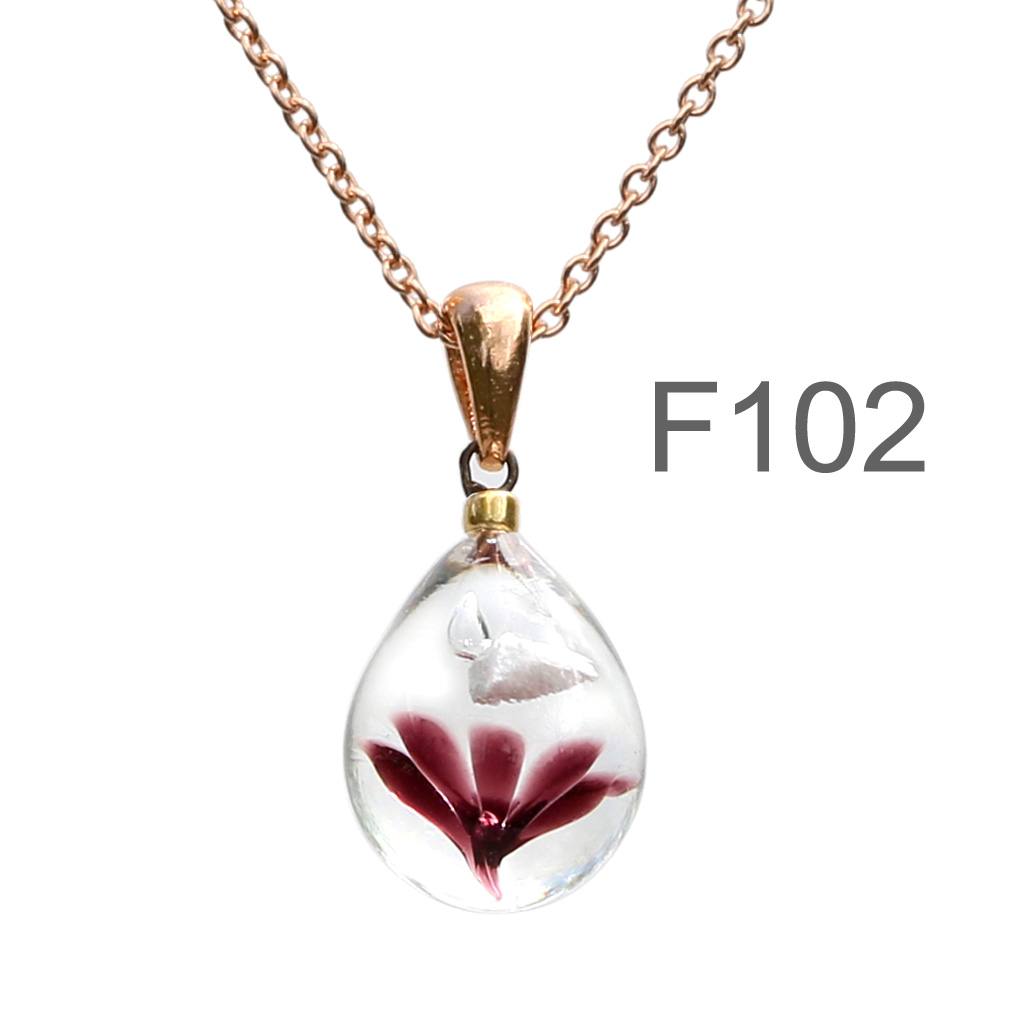 濃い茶色のお花が入った ガラスの遺骨ペンダント