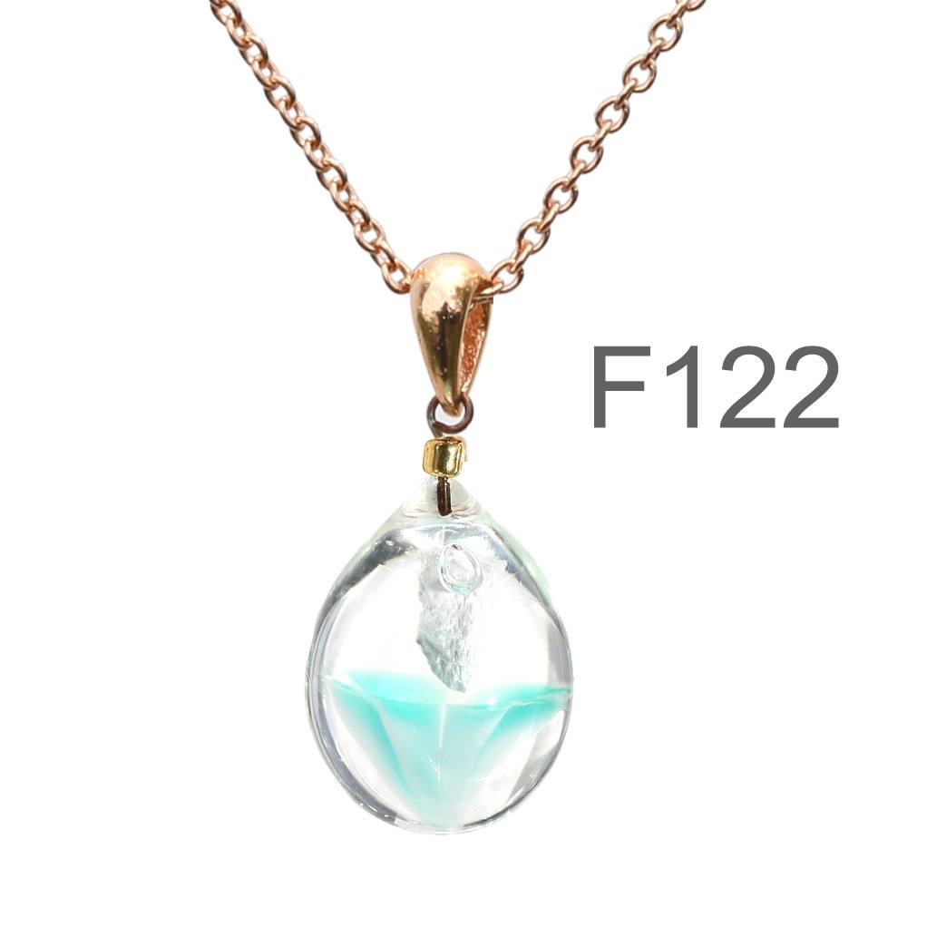 グリーン半透明白色のお花が入った ガラスの遺骨ペンダント