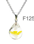 黄色半透明白色のお花が入った ガラスの遺骨ペンダント