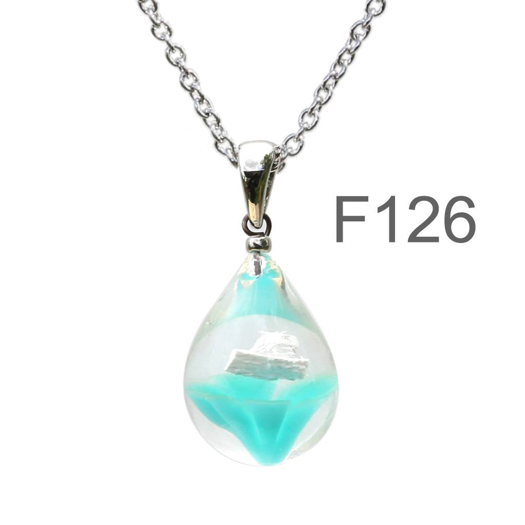 不透明薄青緑色のお花が入った ガラスの遺骨ペンダント