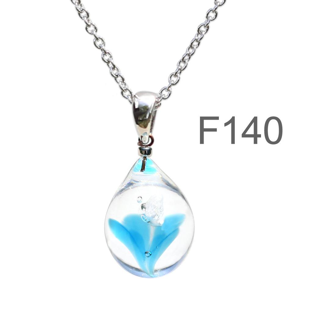 ブルー色のお花が入った ガラスの遺骨ペンダント