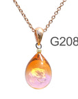 オレンジ薄ピンク色のグラデーションが美しい ガラスの遺骨ペンダント