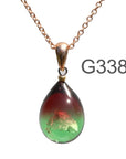 金赤薄グリーン色のグラデーションが美しい ガラスの遺骨ペンダント