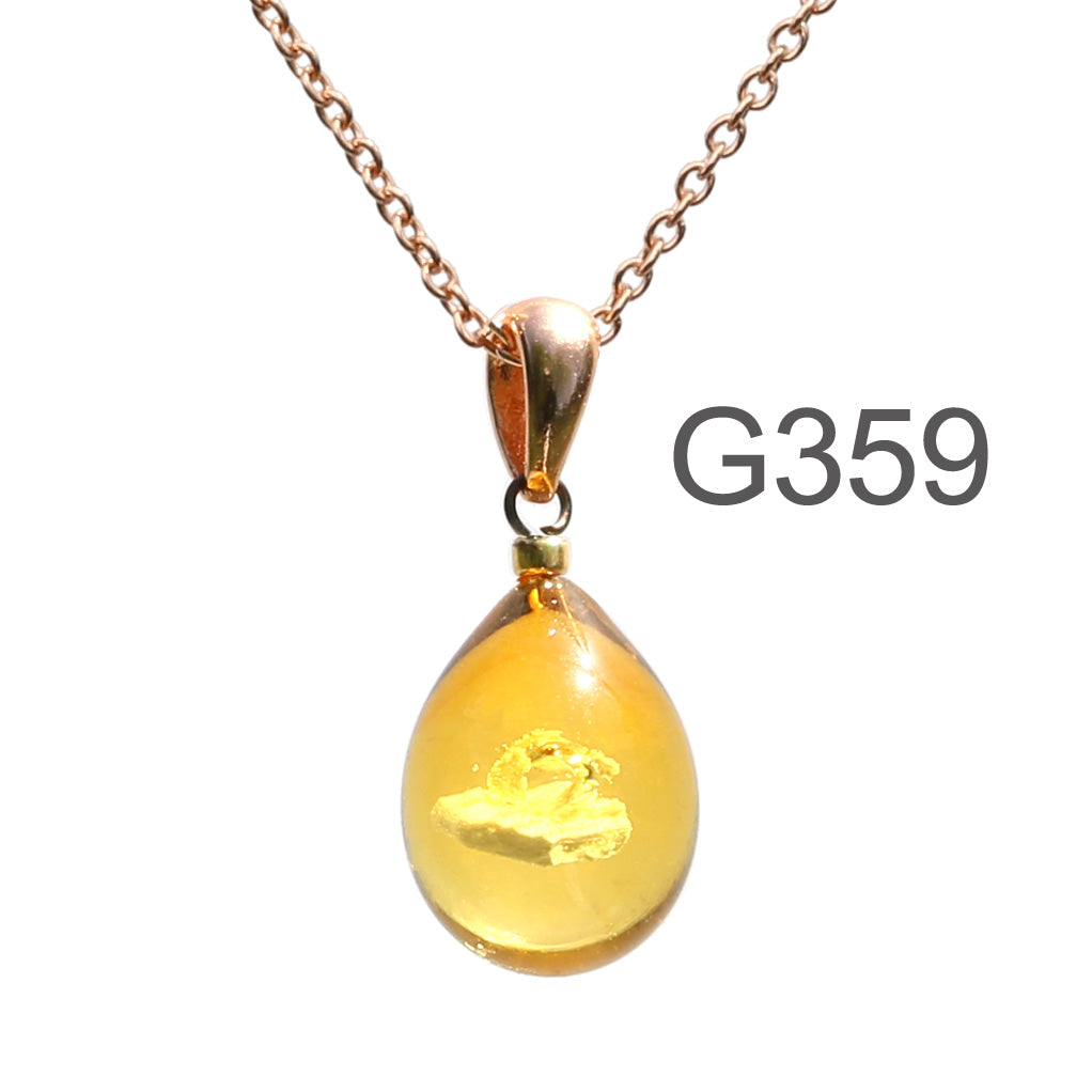 アンバー薄アンバー色のグラデーションが美しい ガラスの遺骨ペンダント