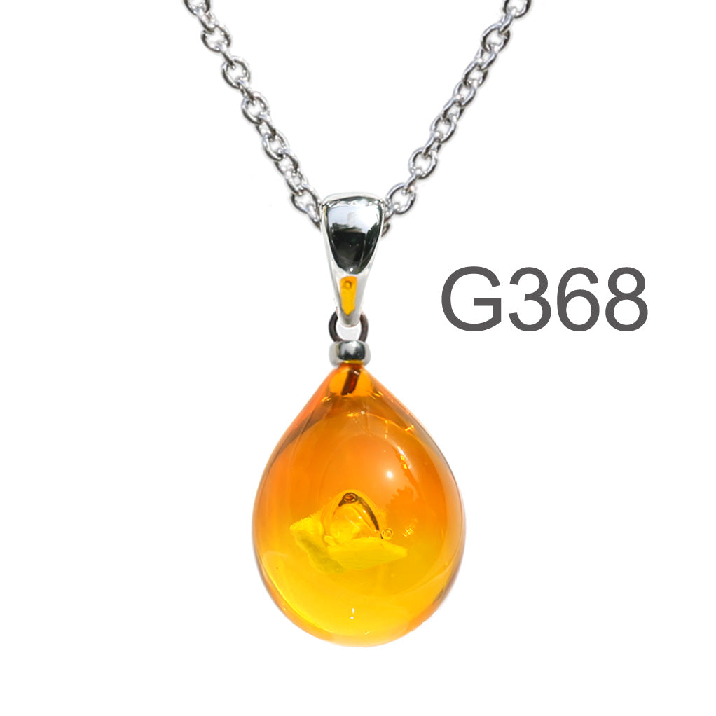 オレンジイエロー色のグラデーションが美しい ガラスの遺骨ペンダント